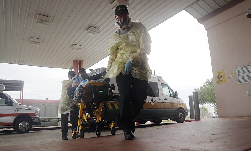 FILE - In this July 28, 2020, file photo, a man arrives at Starr County Memorial Hospital in Rio Grande City, Texas. The number of daily U.S. deaths from the coronavirus is declining again after peaking in early August, but scientists are warning that a new bout with the disease this fall could claim more lives. (AP Photo/Eric Gay, File)