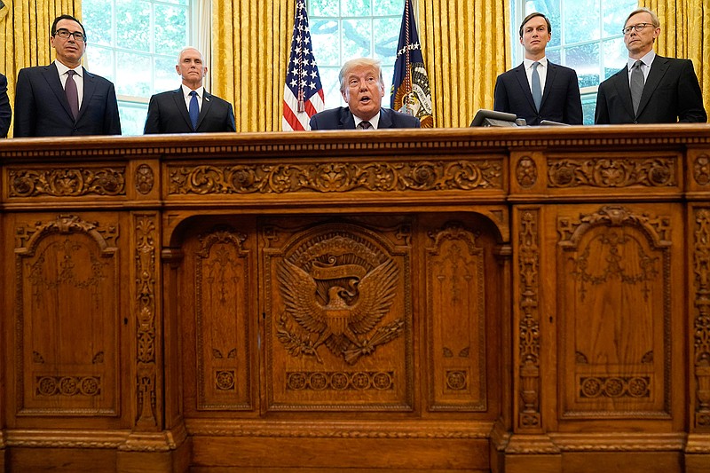 President Donald Trump speaks in the Oval Office of the White House on Friday, Sept. 11, 2020, in Washington. Bahrain has become the latest Arab nation to agree to normalize ties with Israel as part of a broader diplomatic push by Trump and his administration to fully integrate the Jewish state into the Middle East. From left, Treasury Secretary Steven Mnuchin, Vice President Mike Pence, Trump, Jared Kushner and U.S. special envoy for Iran Brian Hook. (AP Photo/Andrew Harnik)