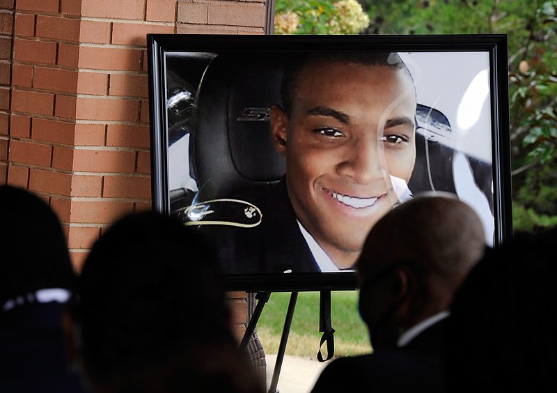 HFM*A photograph of Army veteran Damian Daniels is displayed before mourners during his funeral at Alabama National Cemetery in Montevallo, Ala., on Friday, Sept. 11, 2020. Daniels, an Alabama native who served in Afghanistan, was fatally shot by a sheriff's deputy at his home in San Antonio, Texas, last month. Relatives say he was troubled mentally. (AP Photo/Jay Reeves)