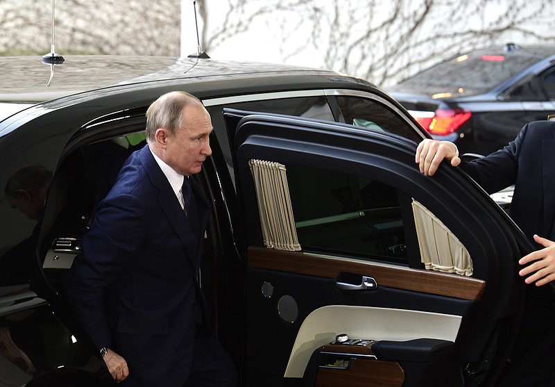 FILE - In this Jan. 19, 2020, file photo Russian President Vladimir Putin arrives for a conference on Libya at the chancellery in Berlin, Germany. A whistleblower’s allegation that he was pressured to suppress intelligence about Russian election interference is the latest in a series of similar accounts involving former Trump administration officials, raising concerns the White House risks undercutting efforts to stop such intrusions if it plays down the seriousness of the problem. (AP Photo/Jens Meyer, File)