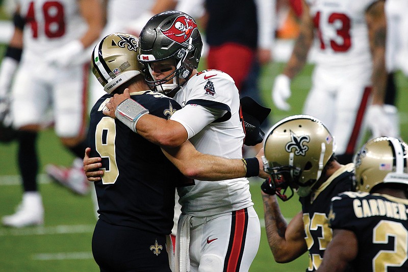 Saints quarterback Drew Brees and Buccaneers quarterback Tom Brady hug after Sunday's game in New Orleans.