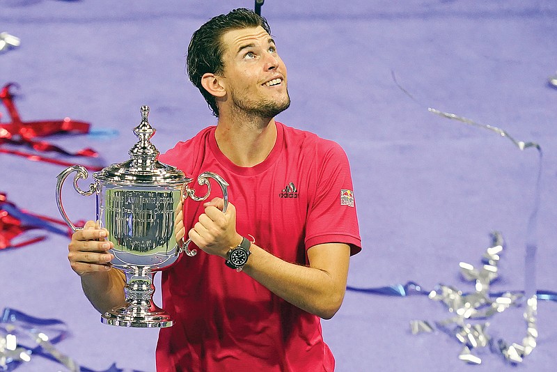 Dominic Thiem holds the championship trophy Sunday after defeating Alexander Zverev in the men's singles final of the U.S. Open in New York.