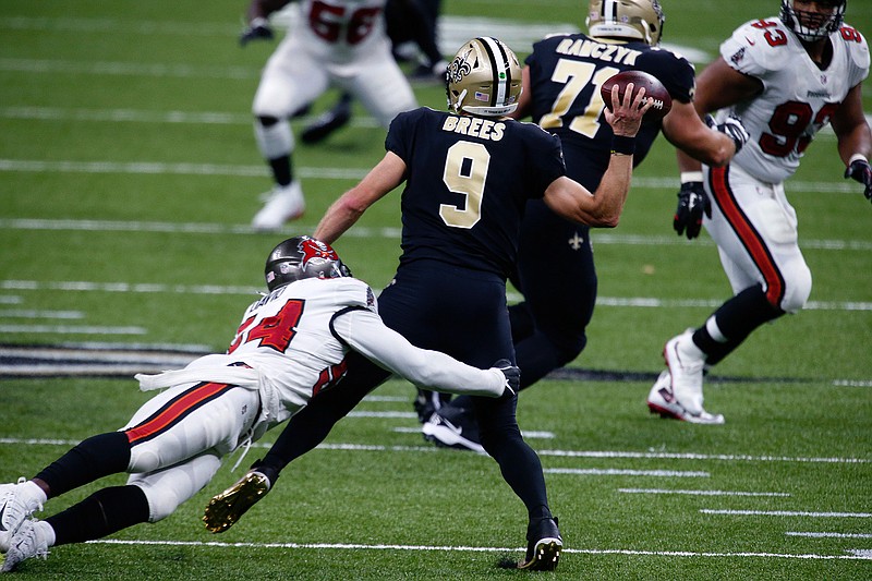 New Orleans Saints quarterback Drew Brees (9) passes under pressure from Tampa Bay Buccaneers outside linebacker Lavonte David (54) in the second half of an NFL football game in New Orleans, Sunday, Sept. 13, 2020. (AP Photo/Butch Dill)
