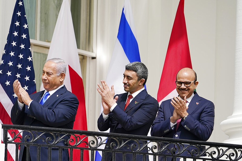 Israeli Prime Minister Benjamin Netanyahu, United Arab Emirates Foreign Minister Abdullah bin Zayed al-NahyanAbraham and Bahrain Foreign Minister Khalid bin Ahmed Al Khalifa stand on the Blue Room Balcony during the Abraham Accords signing ceremony on the South Lawn of the White House, Tuesday, Sept. 15, 2020, in Washington. (AP Photo/Alex Brandon)
