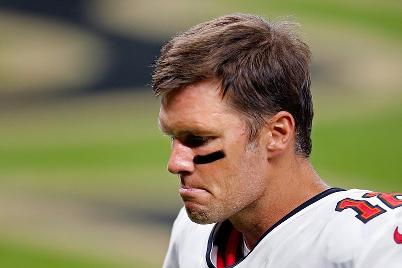 Tampa Bay Buccaneers quarterback Tom Brady (12) reacts after an NFL football game against the New Orleans Saints in New Orleans, Sunday, Sept. 13, 2020. The Saints won 34-23. (AP Photo/Brett Duke)