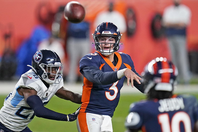 Broncos quarterback Drew Lock throws under pressure from Titans cornerback Kristian Fulton during the second half of Monday night's game in Denver.