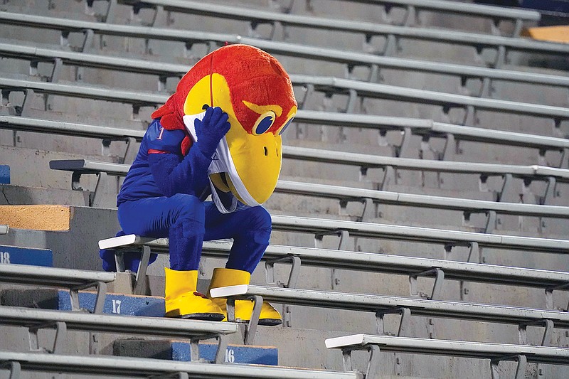 The Kansas Jayhawk mascot sits in the empty stands during the second half of Saturday night's 38-23 loss to Coastal Carolina in Lawrence, Kan.