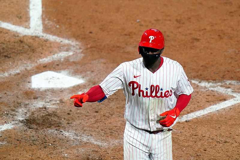 Philadelphia Phillies' Didi Gregorius reacts after hitting a two-run home run off New York Mets pitcher Rick Porcello during the fifth inning of a baseball game, Tuesday, Sept. 15, 2020, in Philadelphia. (AP Photo/Matt Slocum)