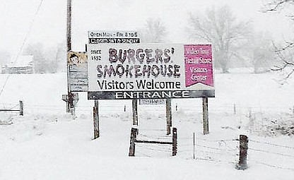 In this California Democrat file photo from March 2013, a sign at the Burgers Smokehouse driveway welcomes visitors during heavy snowfall.
