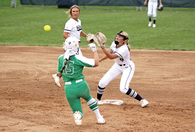 Helias second baseman Payton Dudenhoeffer takes the throw from catcher Paige Schaffer as Ellie Kliethermes of Blair Oaks attempts to steal second base during the fifth inning of Tuesday's game at the American Legion Post 5 Sports Complex.