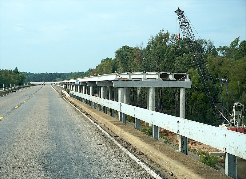 Looking south toward Douglassville on the R.M. Hubbard bridge on State Highway 8, one sees the new bridge rising on the west side. Completion date is six years away.