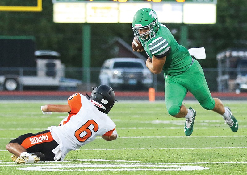 Blair Oaks running back Jayden Purdy tries to dodge an attempted tackle by Knob Noster defensive back Lane Elwell during a game earlier this month at the Falcon Athletic Complex in Wardsville.