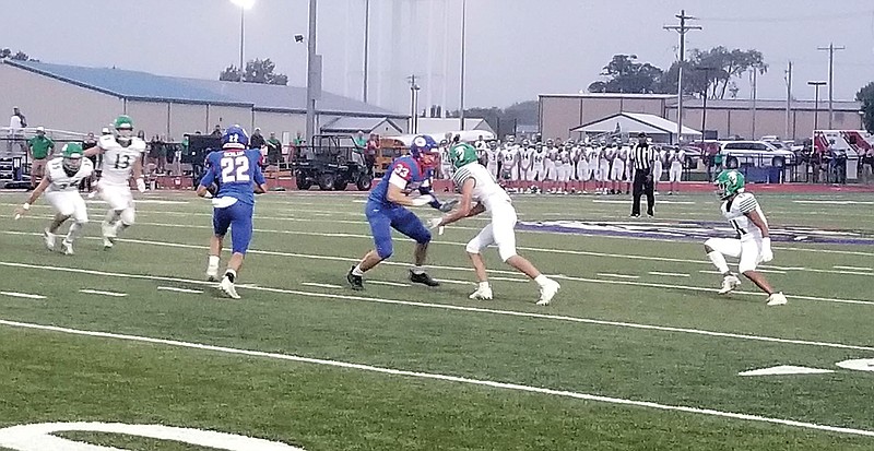 Drake Schlup of California get a block from Trevor Myers during last week's game against Blair Oaks in California.