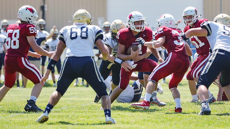 Tipton quarterback Blake Fischer runs the ball during a game against the Helias JV earlier this month in Tipton.