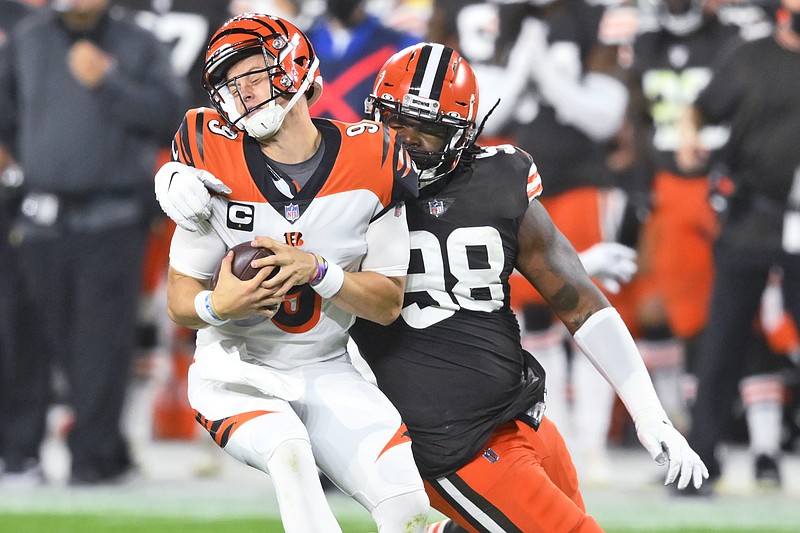 Browns defensive tackle Sheldon Richardson sacks Bengals quarterback Joe Burrow during the first half of Thursday night's game in Cleveland.