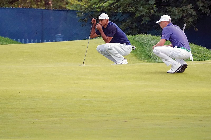 Tiger Woods and Justin Thomas line up their putts on the third green during Thursday's first round of the U.S. Open at Winged Foot in Mamaroneck, N.Y.