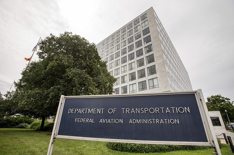 FILE - This June 19, 2015, file photo, shows the Department of Transportation Federal Aviation Administration building in Washington.  The Transportation Department’s Inspector General said in an audit report published Friday, Sept. 18, 2020, that the FAA and hasn't done enough research to evaluate the new risks. In addition, it says the FAA largely only updates standards after accidents and hasn't revised them since a 1991 accident. (AP Photo/Andrew Harnik, File)