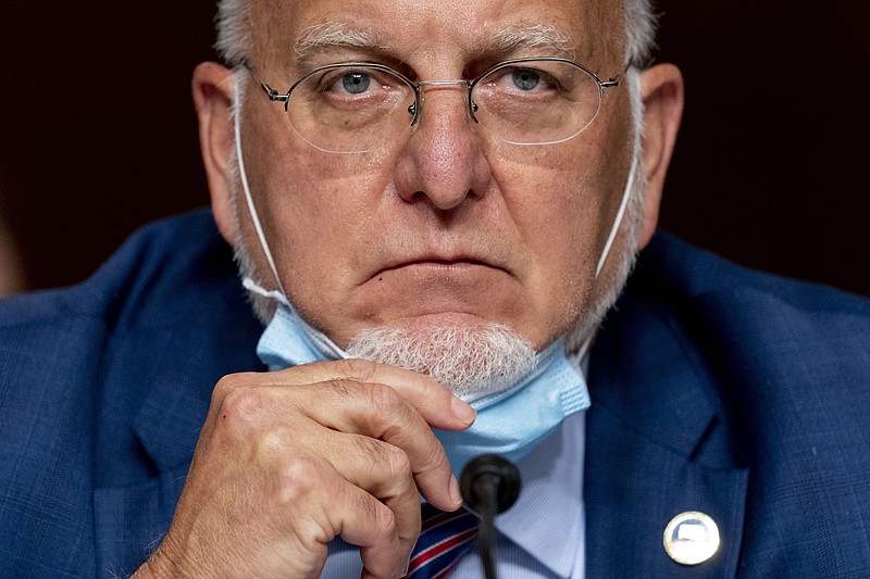 FILE - In this Wednesday, Sept. 16, 2020 file photo, the Centers for Disease Control and Prevention Director Dr. Robert Redfield pauses while speaking at a Senate Appropriations subcommittee hearing on a "Review of Coronavirus Response Efforts" on Capitol Hill in Washington. On Friday, Sept. 18, 2020, the CDC dropped a controversial piece of coronavirus guidance and said anyone who has been in close contact with an infected person should get tested. The CDC essentially returned to its previous testing guidance, getting rid of language posted last month that said people who didn't feel sick didn't need to get tested. (AP Photo/Andrew Harnik, Pool)