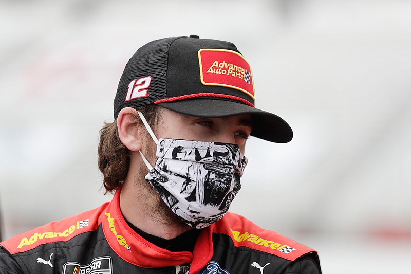 This June 7, 2020, file photo shows Ryan Blaney waiting in pit row before a NASCAR Cup Series auto race at Atlanta Motor Speedway in Hampton, Ga. With a bit of disbelief over his fast fall in NASCAR's standings, Ryan Blaney is determined to avoid elimination from the playoffs. (AP Photo/Brynn Anderson, File)