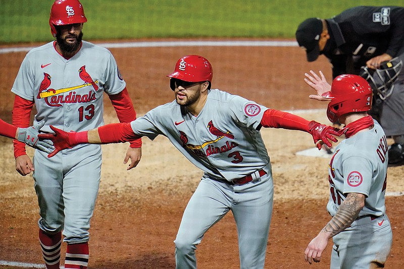 Dylan Carlson of the Cardinals celebrates as he heads to the dugout after hitting a three-run home run off Pirates relief pitcher Chris Stratton during the sixth inning in Game 2 of Friday's doubleheader in Pittsburgh.