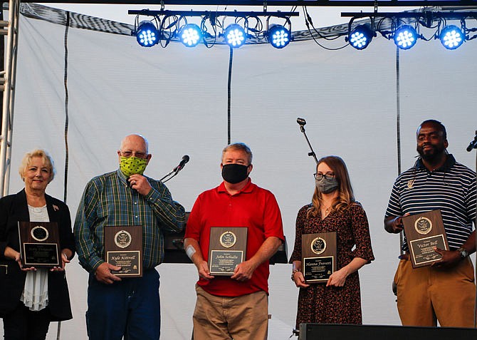 The Fisher Family Good Samaritan Award winners for 2020 — from left, Jody Delgado, Kyle Kittrell, John Schulte, Hannah Frevert and Victor Bell — stand together for a photo on stage after being presented their awards Saturday night, Sept. 19, 2020, during the Redemption Inside the Walls concert at Jefferson City Jaycees Fairgrounds.