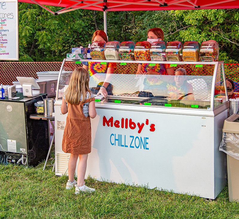 Mellby's Chill Zone sells its ice cream creations at the Holts Summit Community Celebration on Saturday evening.