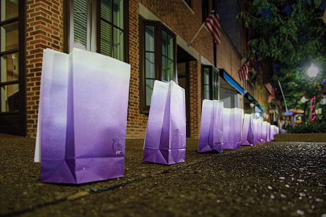 Luminaries line East High Street on Saturday as part of the American Cancer Society Relay for Life, which canceled all in-person events due to COVID-19. The nonprofit offered "A Week of Hope" as an alternative, which involves lining the street with purple lights and flags as a reminder of all the people cancer has affected.