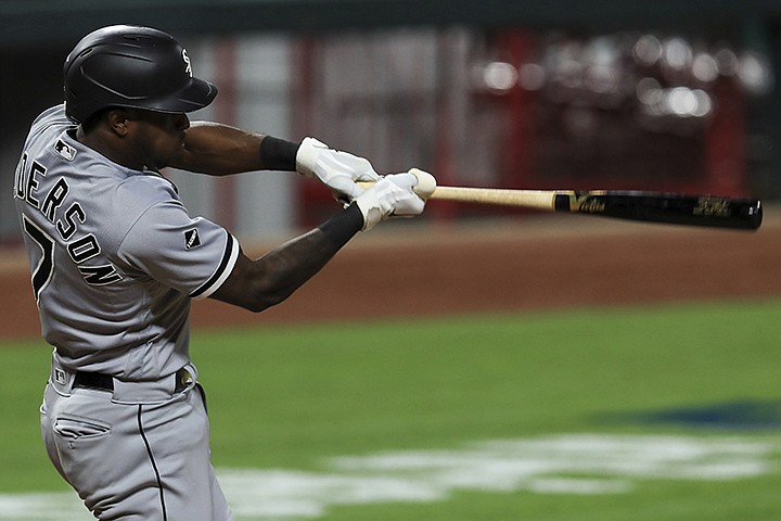 Chicago White Sox's Tim Anderson hits a solo home run in the eighth inning during a baseball game against the Cincinnati Reds in Cincinnati, Saturday, Sept. 19, 2020. (AP Photo/Aaron Doster)