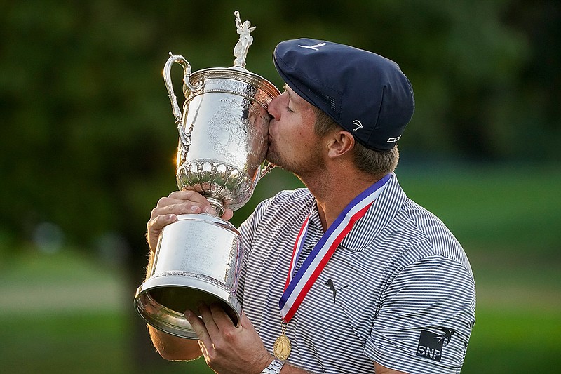 Bryson DeChambeau of the United States kisses the winner's trophy after winning U.S. Open Golf Championship on Sunday in Mamaroneck, N.Y.