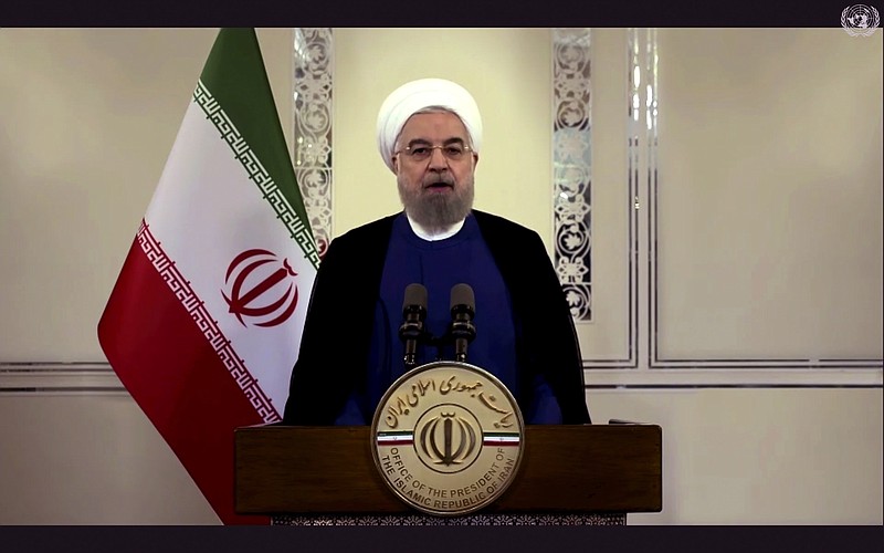 In this image made from UNTV video, Iranian President Hassan Rouhani speaks in a pre-recorded message which was played during the 75th session of the United Nations General Assembly, Tuesday, Sept. 22, 2020, at UN headquarters in New York. The U.N.'s first virtual meeting of world leaders started Tuesday with pre-recorded speeches from some of the planet's biggest powers, kept at home by the coronavirus pandemic that will likely be a dominant theme at their video gathering this year. (UNTV via AP)