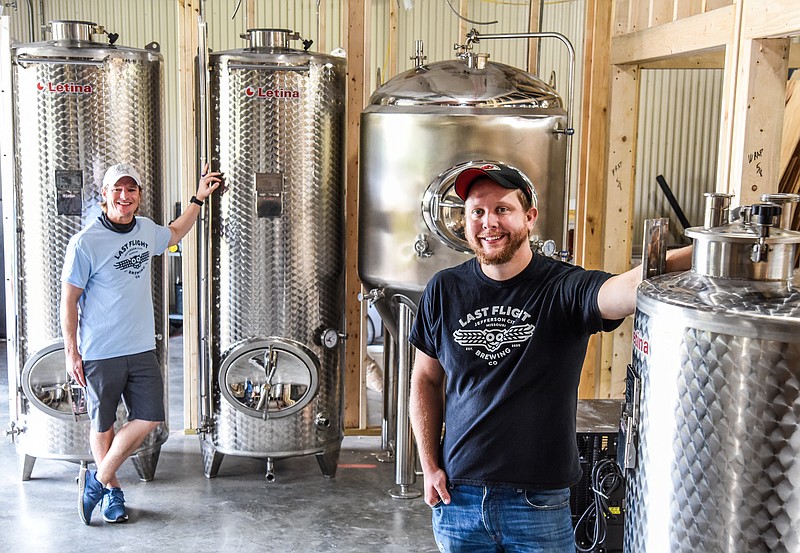 Julie Smith/News Tribune
Cousins Mark Cowley, left, and Jared Cowley pose for a photograph inside the brewing chamber at Last Flight Brewing Co., at 732 Heisinger Rd. The building had previously been housing Cowley Distributing until the business sold. The cousins enjoyed brewing beer so decided to make a go of a business to make their favorite brew and serve it to the public.