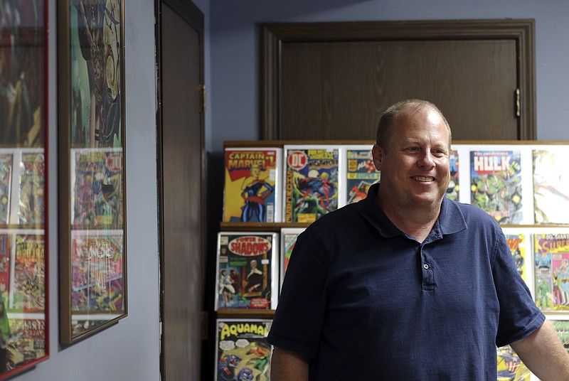 Liv Paggiarino/News Tribune

Layne Wolters just opened Capital City Comics on Thursday along Industrial Drive. Rows and rows of books can be seen on shelves and in boxes for browsing. 