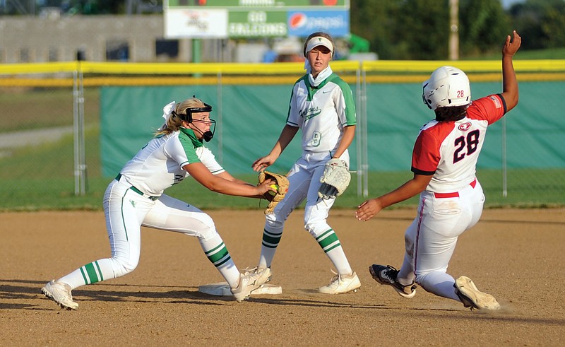 Blair Oaks shortstop Bailey Rissmiller prepares to put the tag on Jefferson City's Amaya Ford during Wednesday's game at the Falcon Athletic Complex in Wardsville. Backing up the play is Blair Oaks second baseman Kadence Kliegel. 