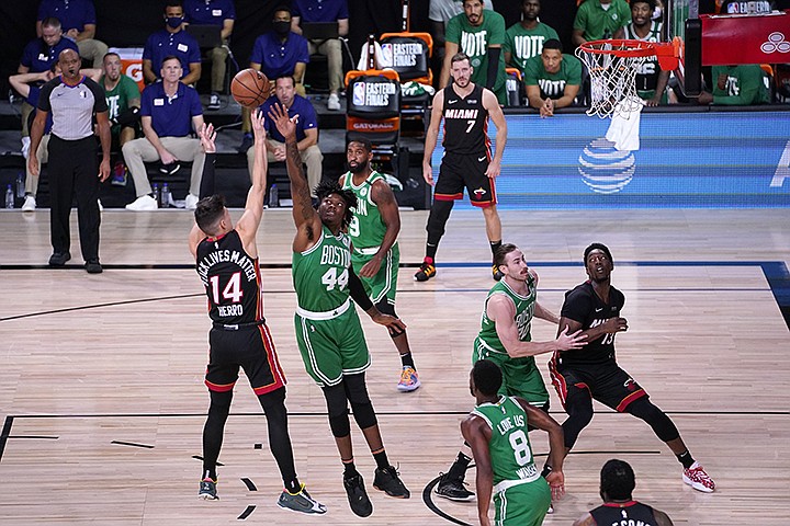 Miami Heat guard Tyler Herro (14) takes a shot over Boston Celtics' Robert Williams III (44) during the first half of Game 4 of an NBA basketball Eastern Conference final, Wednesday, Sept. 23, 2020, in Lake Buena Vista, Fla. (AP Photo/Mark J. Terrill)
