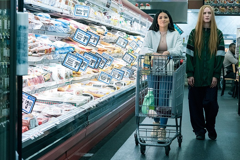 Gina Rodriguez (left) stars as "Melanie" and Evan Rachel Wood (right) stars as "Old Dolio Dyne" in director Miranda July's "Kajillionaire." (Matt Kennedy/Focus Features/TNS)