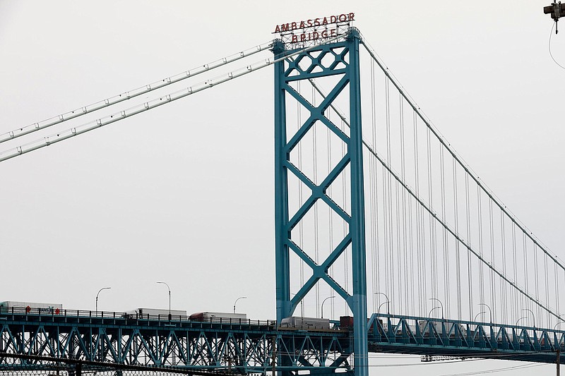 Vehicles cross the Ambassador Bridge in to Detroit from Windsor, Canada, on March 18, 2020. (Jeff Kowalsky/AFP/Getty Images/TNS)