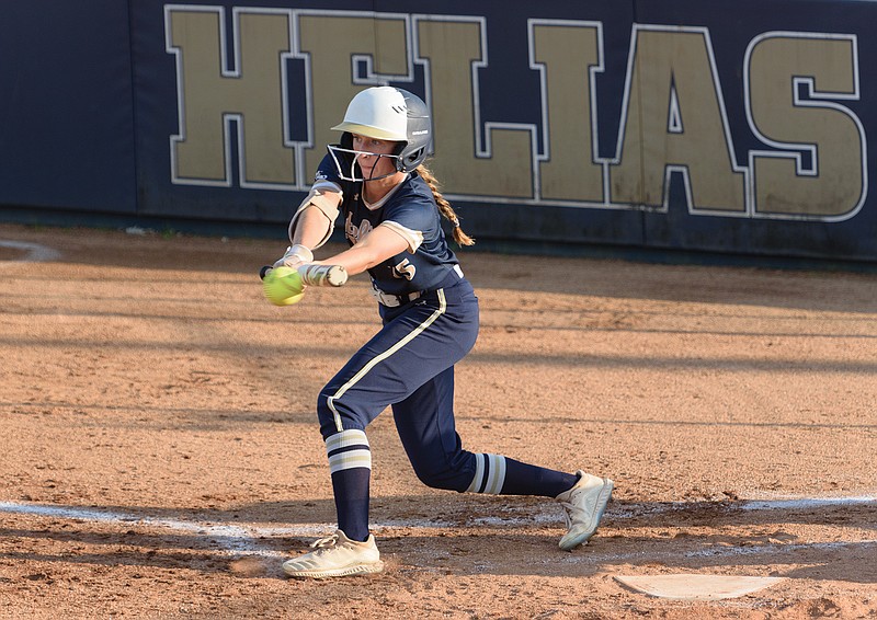 Helias' Liv Bloomer lays down a sacrifice bunt in the bottom of the third inning of Wednesday's game against Battle at the American Legion Post 5 Sports Complex.