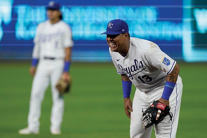 Salvador Perez of the Royals smiles while playing first base as he waits in the ninth inning for the end of the team's game Wednesday night against the Cardinals at Kauffman Stadium.