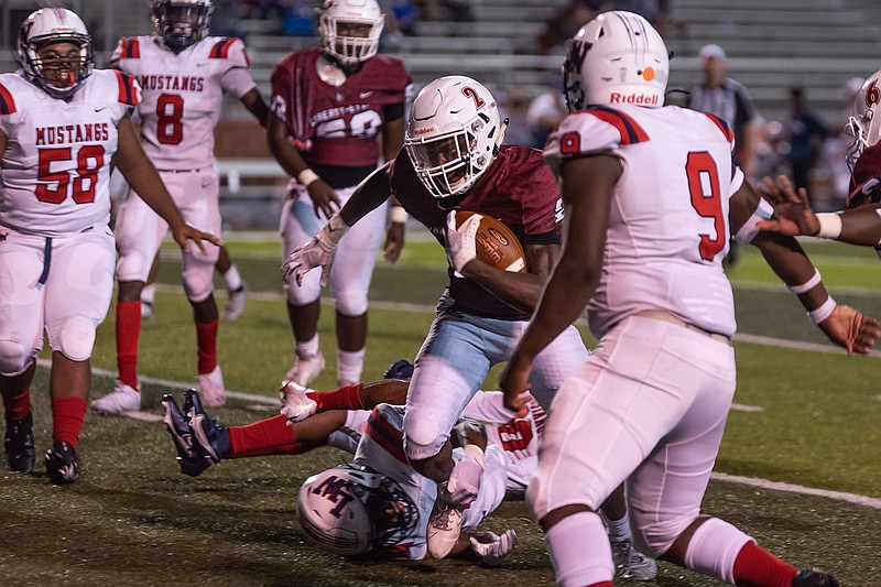 Liberty-Eylau cornerback Se'maj Rose dodges Life Waxahachie  players Friday night at Harris Field in Texarkana.The L-E Leopards roared back to score 41 unanswered points to extend its win streak to three in a row and defeat the Mustangs, 49-21.