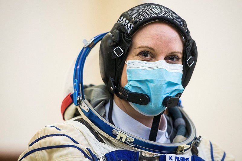 This photo provided by NASA. Expedition 64 crew member NASA astronaut Kate Rubins, is seen during Soyuz qualification exams Wednesday, Sept. 23, 2020 at the Gagarin Cosmonaut Training Center (GCTC) in Star City, Russia. Rubins told The Associated Press on Friday, Sept. 25 that she plans to cast her next vote from space  more than 200 miles above Earth. Rubins and two Russian cosmonauts are preparing for a mid-October launch to the International Space Station, where she'll spend the next six months.  (Andrey Shelepin/GCTC/NASA via AP)
