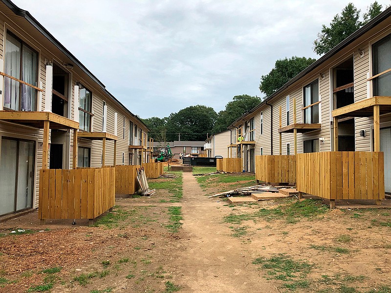 Buildings at Hunter Oaks Apartments undergo renovations on Tuesday. Sept. 22, 2020, in Memphis, Tenn. Owners of the apartment complex are among seven landlords who manage or own more than 5,000 rental units and have filed a lawsuit claiming that a national eviction moratorium has not only placed them under unfair financial strain, but also infringed on their rights as property owners. (AP Photo/Adrian Sainz)