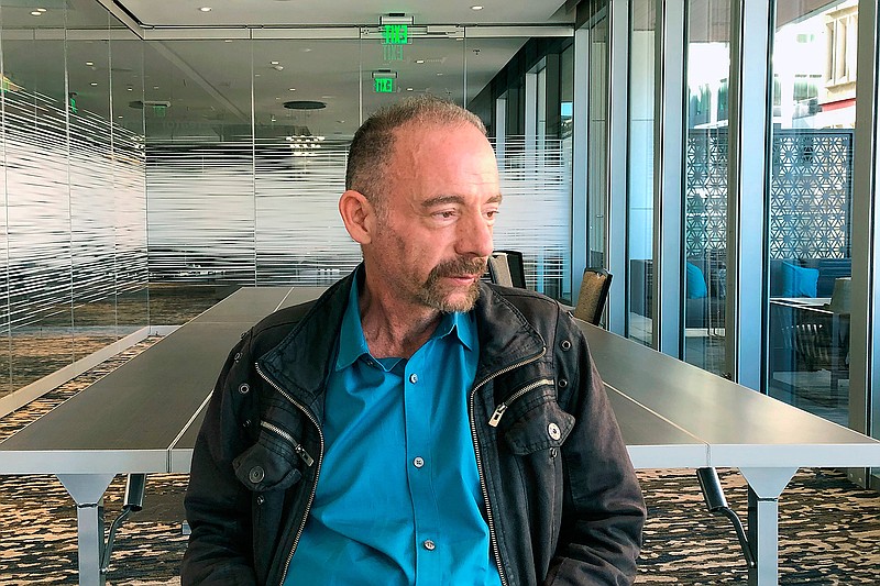 In this Monday, March 4, 2019 file photo, Timothy Ray Brown poses for a portrait in Seattle.  Brown, an American who was known for years as the Berlin patient, had a transplant in Germany from a donor with natural resistance to the AIDS virus. It was thought to have cured Brown's leukemia and HIV. But in an interview Thursday, Sept. 24, 2020, Brown said his cancer returned last year and has spread widely. His case has inspired scientists to seek more practical ways to try to cure the disease.  (AP Photo/Manuel Valdes)