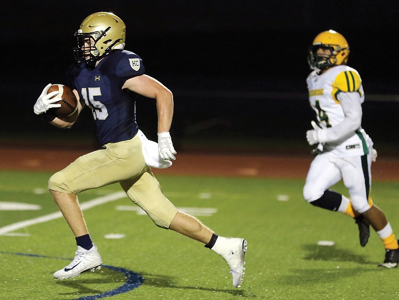 Helias receiver Cole Stumpe runs in for a touchdown during Friday's Homecoming game against Rock Bridge at Ray Hentges Stadium.