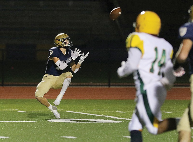 Helias wide receiver Drew Higgins makes a catch just inside the 20-yard line during Friday's game against Rock Bridge at Ray Hentges Stadium.