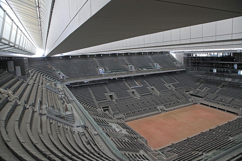 In this Wednesday, May 27 file photo, a general view of the Philippe-Chatrier tennis court with its new retractable roof is shown during a media tour at Roland Garros in Paris.