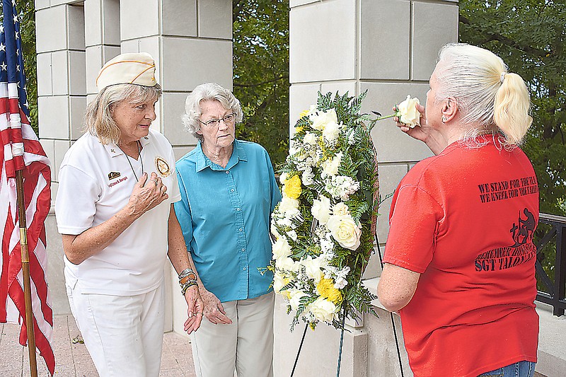 From left, Gold Star mothers Sandy Deraps, Edie Page and Lisa Corbet lay a wreath during Sunday's Gold Star Mother's Day celebration on the north side of the Capitol.