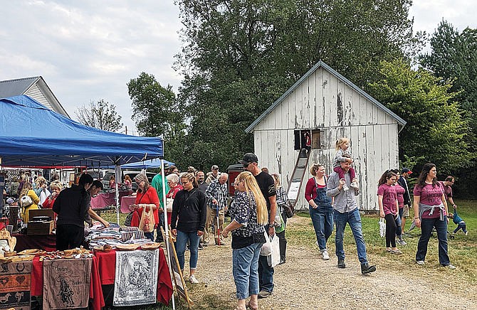 Craft hunters browse the booths during last year's Hatton Arts & Crafts Festival. The craft fair returns from 8 a.m.-4 p.m. this Saturday.