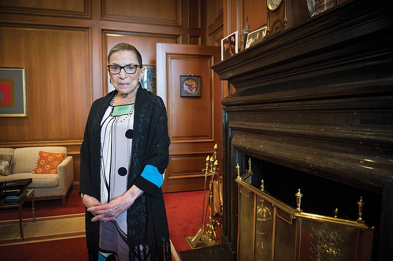 In this July 31, 2014, file photo, Associate Justice Ruth Bader Ginsburg is seen in her chambers in at the Supreme Court in Washington. The Supreme Court says Ginsburg has died of metastatic pancreatic cancer at age 87. (AP Photo/Cliff Owen, File)