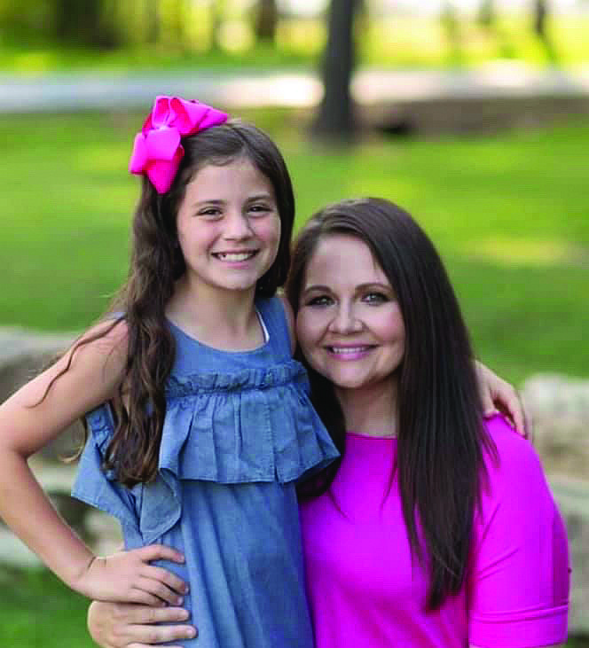 Hannah Sullivan, right, and her daughter, Kinleigh, pose in 2018 while taking pictures for a billboard that touted the importance of mammograms. (CONTRIBUTED PHOTO)