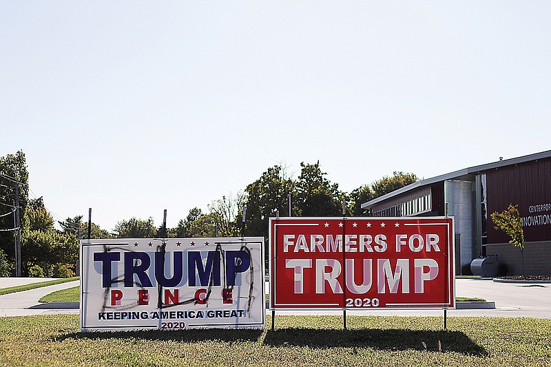 The initials for Black Lives Matter are spray painted over Trump-Pence campaign signs in front of the Missouri Soybean Association. The signs have been left up to show they've been tampered with. Signs for both liberal and conservative candidates have been reported as vandalized recently.
